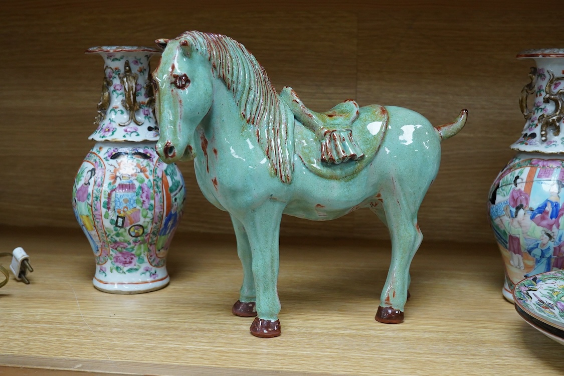 A pair of Chinese famille rose vases, two Canton plates and a green glazed horse, largest 29cm wide